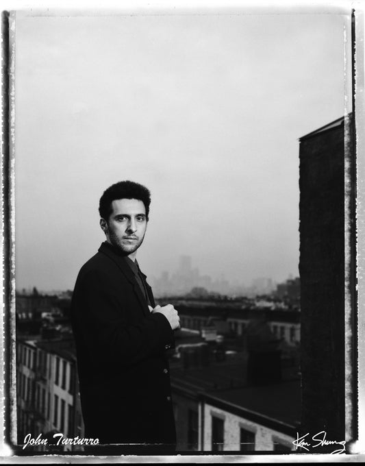 actor john turturro on his rooftop in brooklyn photographed by Ken Shung with a polaroid camera on pos/neg polaroid film