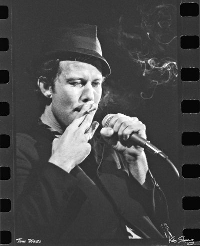 Portrait of Tom Waits on stage at the Club My Fathers Place in 1976 